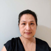 Portrait Sandy C: Woman massage therapist at home